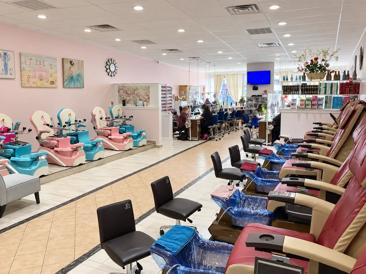 Wide view of the Allure salon floor with its row of pedicure chairs