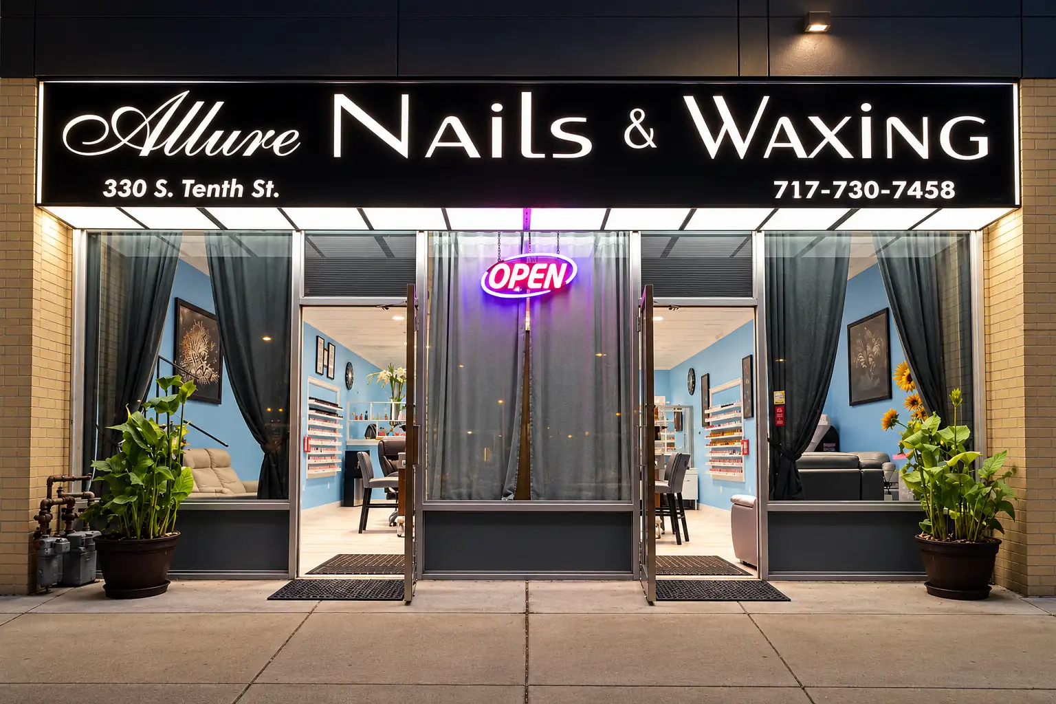 The Allure Nails & Beauty shopfront on South Tenth Street in Lemoyne, lit at night